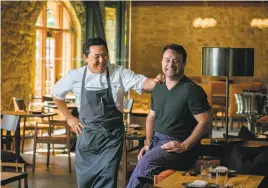  ??  ?? Chefs Sang Yoon (left) and Douglas Keane at Two Birds/One Stone, the restaurant they run together in St. Helena.