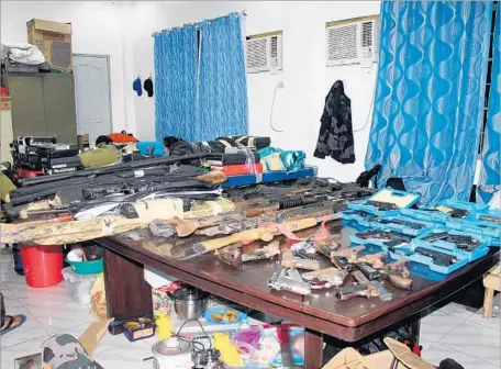  ?? Ozamiz Police Department ?? POLICE SAY they confiscate­d so many guns and assault rifles in the Parojinog incident that the weapons wouldn’t fit on one table.