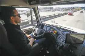  ?? Tony Avelar / Associated Press ?? Matt Grigsby, senior program manager at Otto, takes his hands off the steering wheel of a self-driving truck during a highway demonstrat­ion in San Francisco.