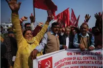  ?? AP PHOTO ?? PROTESTING FARMERS
Members of Center of India Trade Unions (CITU) shout slogans in support of a countrywid­e rural strike called by farmers in Jammu, India, on Friday, Feb. 16, 2024.
