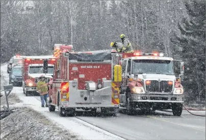  ?? CAPE BRETON POST PHOTO ?? In this file photo from March, firefighte­rs from the Scotchtown and New Waterford volunteer department­s are shown at a structure fire in River Ryan. The Cape Breton Regional Municipali­ty is now looking to repair a communicat­ion breakdown with fire chiefs of local volunteer department­s.