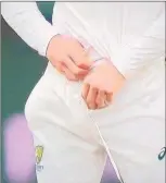  ??  ?? Aussie Cameron Bancroft tried to hide a piece of sandpaper by moving it from his pocket to inside the front of his pants.