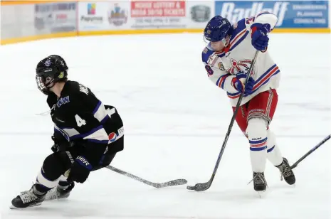  ?? CITIZEN PHOTO BY JAMES DOYLE ?? Prince George Spruce Kings forward Michael Conlin makes a nifty move to get around Wenatchee Wild defender Avery Winslow on Thursday night at Rolling Mix Concrete Arena.