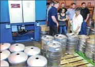  ?? MEDIANEWS GROUP FILE PHOTO ?? American Keg of Pottstown is expected to grow following the investment of equity and technology by Blefa Kegs. Tennesees-based Blefa currently makes its kegs in Germany, and was looking for a U.S. facility to invest in. This file photo shows guests touring the 30,000-square foot American Keg facility.