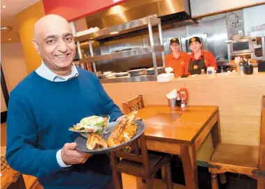  ??  ?? Harry Patel at his Gourmet Chicken restaurant in 2018. Ref:129284-11