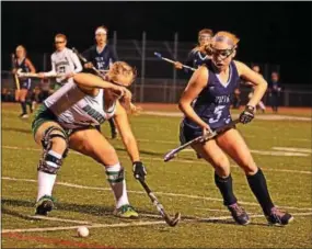  ?? BILL RUDICK — DIGITAL FIRST MEDIA ?? Emily Doyle of Villa Maria tries to get around Rachel Robinson of Donegal in the PIAA field hockey semifinal Tuesday.