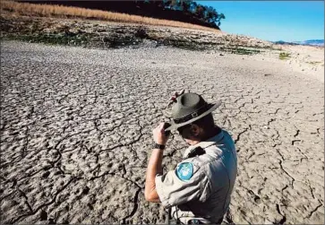  ?? Brian van der Brug
Los Angeles Times ?? RANGER JEFF BOZARTH stands in a former bay of Cachuma Lake in Santa Barbara County on Jan. 14.