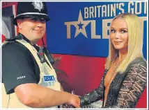  ??  ?? COP AN EYEFUL: Amanda greets policeman