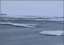  ?? Photo by Diana Haecker ?? OPEN WATER— The storms broke up ice and left the mouth of the Nome River with ice floes bobbing in open water.