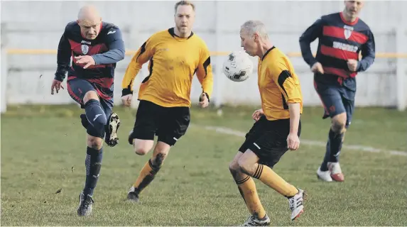  ??  ?? Over-40s football between Boldon Colliery Old Barrel (navy red) and Ivy Legends, played at Boldon CA Sports Ground.