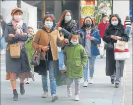  ?? AP ?? People visit a shopping district in Taipei, Taiwan on Friday. According to the Taiwan Centers of Disease Control, the tenth case diagnosed with the new coronaviru­s has been confirmed in Taiwan.