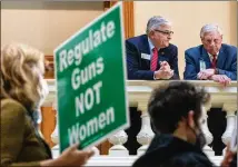  ?? ARVIN TEMKAR/ARVIN.TEMKAR@AJC.COM ?? Rep. Danny Mathis speaks with a lobbyist, while legislator­s and reproducti­ve rights group Amplify Atlanta announced new abortion-rights legislatio­n at the Capitol on Tuesday.