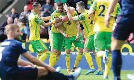  ?? Photograph: Stephen Pond/Getty Images ?? Pierre Lees-Melou (centre) gave Norwich the lead with a deflected effort in the ninth minute.