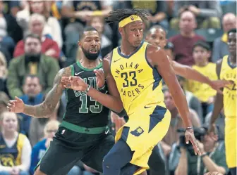  ?? ASSOCIATED PRESS ?? HOLD YOUR GROUND: Marcus Morris (13) defends against Myles Turner during the Celtics’ 102-101 to the Pacers on Saturday in Indianapol­is.