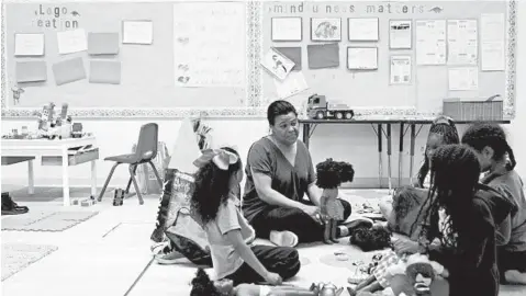  ?? GABRIELLA ANGOTTI-JONES/LOS ANGELES TIMES ?? Therapist Renee Curry leads a group of Crete Academy students during a therapy session in March in Los Angeles.