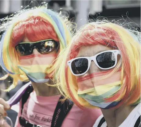  ?? ?? 0 Revellers take part in Zurich Pride in Switzerlan­d, which recently adopted a ‘self-declaratio­n’ approach to gender