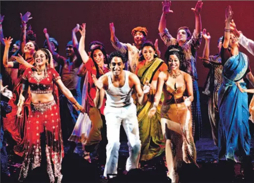  ?? TIMOTHY A. CLARY/ AFP/ GETTY IMAGES ?? Cast members of the Broadway version of Bombay Dreams take a curtain call at the end of their opening night performanc­e in New York in April 2004.