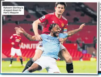  ??  ?? Raheem Sterling is dragged down by Harry Maguire