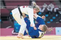  ?? KIICHIRO SATO THE ASSOCIATED PRESS ?? After their judo match, Priscilla Gagné, top, said Cherine Abdellaoui was “much quicker than I remember her.”