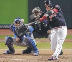  ??  ?? Cleveland Indians' Roberto Perez smashes a three-run homer.