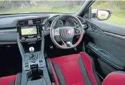  ??  ?? The interior features an excellent driving position and typical Type-R trim.