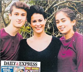  ??  ?? Laura with Noah and Molly and the Daily Express on March 24