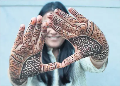  ?? ANDREA YU ?? As a former graphic designer, Nadine Dafrawy favours simpler designs and geometric patterns in her henna art, such as this motif.