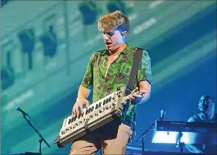  ?? PHOTOS BY NICHOLAS BUONANNO — NBUONANNO@TROYRECORD.COM ?? Charlie Puth plays on his keyboard guitar while performing Sunday night at Saratoga Performing Arts Center.