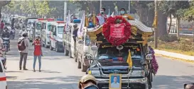  ?? (AFP) ?? A convoy of cars makes its way during the funeral for protester Thet Naing Win, who died from a gunshot wound while taking part in a demonstrat­ion last week, in Mandalay on Tuesday