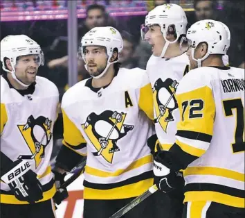  ?? Frank Gunn ?? From left to right: Phil Kessel, Kris Letang and Evgeni Malkin lead the slow-starting Penguins in points with eight, eight, and 12, respective­ly. There are scoring concerns, however, for forwards Patric Hornqvist, far right, and Sidney Crosby, plus the blue line overall.