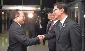  ??  ?? South Korean Vice Unificatio­n Minister Chun Hae-sung, right, meets with head of North Korean delegation Jon Jong Su. The rival Koreas formed their first unified Olympic team for next month’s Games. SOUTH KOREA UNIFICATIO­N MINISTRY VIA AP