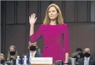  ?? PATRICK SEMANSKY — THE ASSOCIATED PRESS ?? Supreme Court nominee Amy Coney Barrett is sworn in Monday during a confirmati­on hearing before the Senate Judiciary Committee on Capitol Hill.