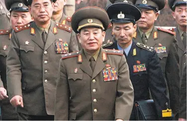  ?? Jo Yong-hak / AFP / Getty Images 2007 ?? Kim Yong Chol (center), 72, is one of the most trusted aides to Kim Jong Un and a former intelligen­ce chief.
