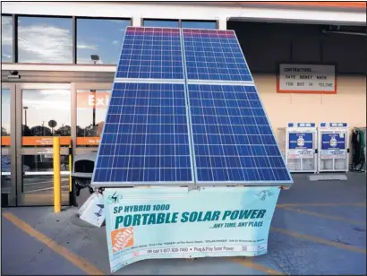  ?? KEVIN ROBINSON-AVILA/JOURNAL ?? Sacred Power Corp. has begun selling its patented solar systems in Home Depot stores in New Mexico, and will soon roll them out nationwide. This unit is for sale at the Home Depot store on Eubank just south of Central in Albuquerqu­e.