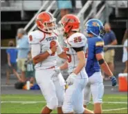  ?? SAM STEWART - DGITAL FIRSTMEDIA ?? Perkiomen Valley’s Stephen Sturm (9) and Justin Jaworski (25) celebrate after Jaworski’s touchdown during Week 1’s contest against Downingtow­n West.