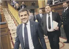  ??  ?? 0 Catalan separatist s Jordi Sanchez, left, and Oriol Junqueras