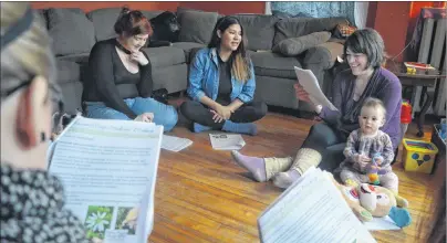  ?? NIKKI SULLIVAN/CAPE BRETON POST ?? Amber Tapley, right, addresses students in her Ancient Ways Medicine Making course on April 7, which is held once a month in her Sydney home. Ten women are taking the course which teaches skills like how to recognize plants good for traditiona­l folk...