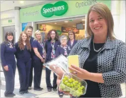  ??  ?? Helen Wathen of Kent Multiple Sclerosis Therapy Centre joins Specsavers, Ashford, in supporting the Big Quiz