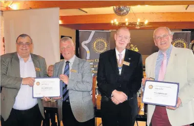  ??  ?? Presentati­on Iain Fraser receives his Paul Harris Fellowship from Assistant Governor elect Alistair Spowage while President Peter Farr receives his from Lawrie Orr at last week’s Bridge of Allan and Dunblane Rotary Club meeting