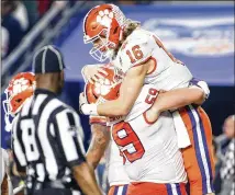  ?? GETTY IMAGES ?? To remain undefeated in his college career, Clemson’s Trevor Lawrence delivered big time Saturday with a come-from-behind, four-play, 94-yard scoring drive in the fourth quarter.