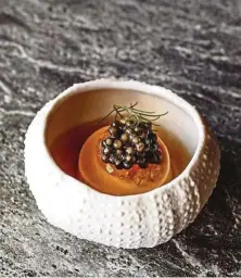  ??  ?? By framing sea urchin with liquorice on one side and yuzu on the other, Crenn says the dish draws on the complexity of French cuisine and the delicacy of Japanese cuisine in a simple and gratifying compositio­n.