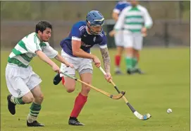  ?? Photograph: Kevin McGlynn. ?? Jamie Forgrieve, Oban Celtic, battles with Roddy MacDonald, Kyles, in the Macaulay Cup clash at Mossfield, Oban.