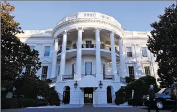  ?? The Associated Press ?? WHITE HOUSE: In this Nov. 8, 2016, photo, the White House in Washington. On Inaugurati­on Day, it’s supposed to feel like home when Donald Trump enters the White House residence for the first time as president. His clothes will be hanging in the closet....