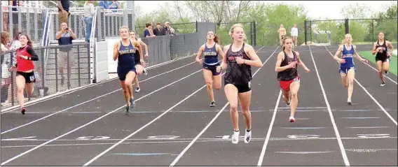  ?? (Special to NWA Democrat-Gazette/John McGee) ?? Lady Blackhawk senior Blakelee Winn and sophomore Kamree Dye led the pack in the 200-meter dash coming in with times of 26.24 and 27.20 respective­ly taking first and second place in the 4A-1 District track meet last week.