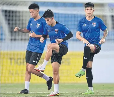  ?? ?? Thailand players train ahead of the first leg of their final match against Vietnam in Hanoi today.