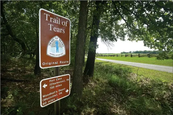  ?? Staff photograph­s by Ben Goff ?? A sign marks the historic route of the Trail of Tears Friday as it passes through Pea Ridge National Military Park. The National Park Service and Trail of Tears Associatio­n are working to add more signs for Trail of Tears sites throughout Benton and...