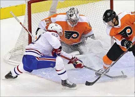  ?? FRANK GUNN — THE CANADIAN PRESS VIA AP ?? Philadelph­ia Flyers goaltender Carter Hart (79) makes a save on Montreal Canadiens’ Artturi Lehkonen (62) as Flyers’ Philippe Myers (5) defends during the second period of an NHL Eastern Conference Stanley Cup hockey playoff game in Toronto Wednesday.