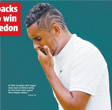  ?? Picture: AP ?? IN PAIN: Australia’s Nick Kyrgios shows signs of distress during his first-round match against Pierre-Hugues Herbert.