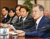  ?? BAE JAE-MAN / YONHAP / VIA AP ?? South Korean President Moon Jae-in (right) speaks Monday with his top aides during a meeting at the presidenti­al Blue House in Seoul, South Korea. Moon urged North Korea and the U.S. to dial down their rhetoric to make talks possible.