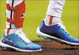  ?? Andrew Harnik The Associated Press ?? Nationals outfielder Bryce Harper, a Las Vegas baseball product, wears shoes with Jackie Robinson’s signature in honor of Jackie Robinson Day on Sunday.